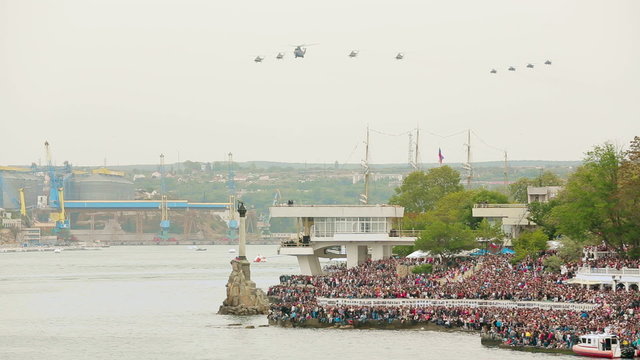 Helicopters flying in the sky during military parade. Overall