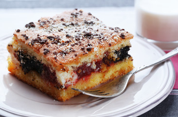 Homemade pie with jam and glass of milk
