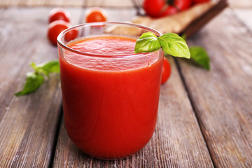 Glass of tomato juice with cherry tomatoes