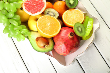 Assortment of fruits on wooden table