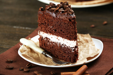 Delicious chocolate cake on table close-up