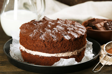 Fototapeta na wymiar Delicious chocolate cake on table close-up