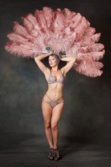 Burlesque dancer with feather fans