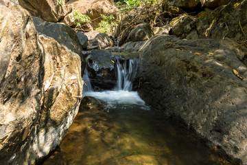 Small waterfall with natural light.