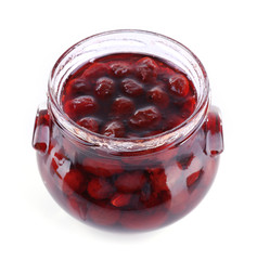 Homemade jar of plum jam isolated on white background