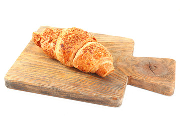 Fresh and tasty croissant with chocolate, isolated on white
