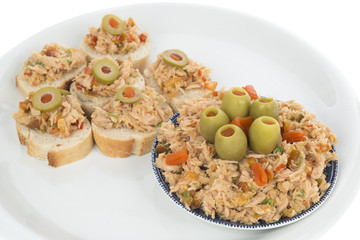 Bread with tuna salad topping on dish