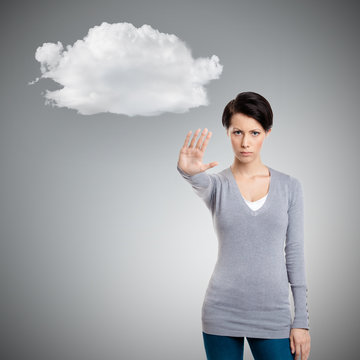 Smart girl shows stop gesture to cloud, isolated