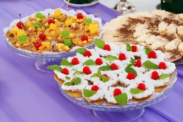 cream desserts with canapes on a plate in a restaurant