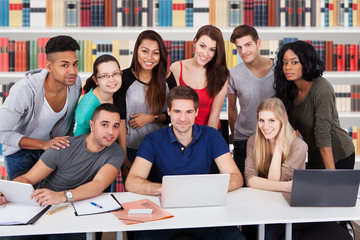 Group Of Multiethnic Friends In Library