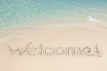 Welcome Written On Sand By Sea