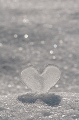 Ice heart in glittering snow.