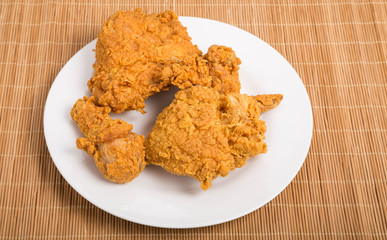 Fried Chicken on White Plate and Bamboo Mat