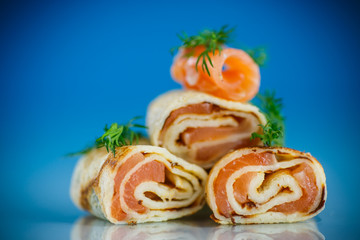  rolls of thin pancakes with salted red fish