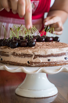 Assembling the Chocolate Sponge Cake with Cream and Cherries