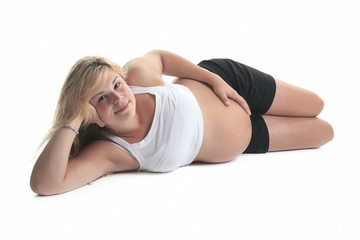 Photo of a pregnant woman over studio white background