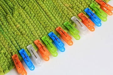 clothespins on green rug