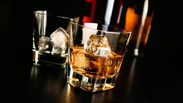 pouring whiskey on bar table lounge bar atmosphere