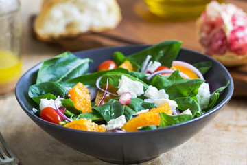 Orange with spinach, pomegranate and feta cheese salad
