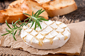 Baked Camembert cheese with rosemary and toast 