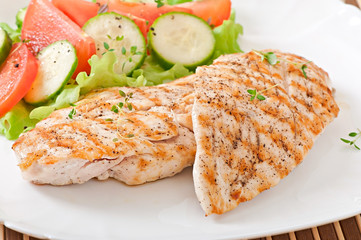Grilled chicken breasts and vegetables
