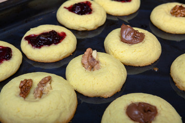 Sweet homemade pastries with jam, chocolate, and pecan