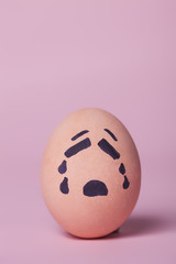 Sad orange painted egg