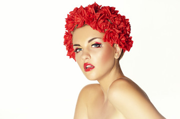 Beautiful young girl with red flowers