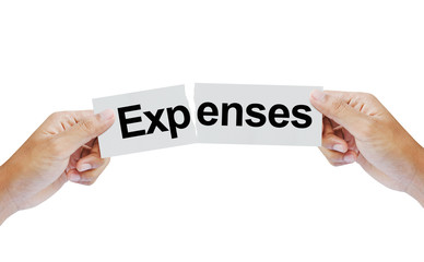 Hand tearing the word Expenses