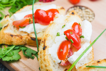 traditional Spanish tapas with cheese and tomatoes 