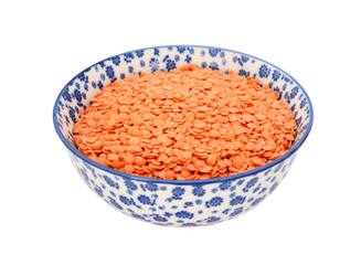 Red lentils in a blue and white china bowl