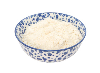 All purpose flour in a blue and white china bowl