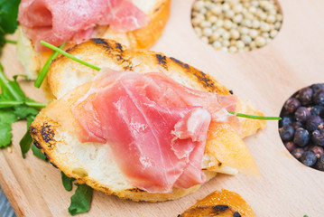 traditional Spanish tapas with slices of hamon and melon on a