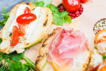 mix of traditional Spanish tapas on a wooden plate with decor