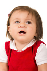portrait of adorable brunette baby girl wearing red dress