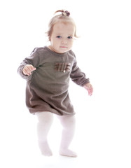 Pretty little girl jumping.