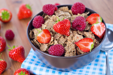 Bran flakes with fresh raspberries and strawberries