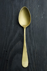 Single golden spoon