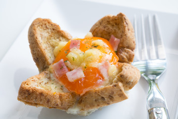 Bread and egg on white dish