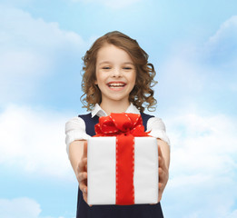 happy smiling girl with gift box