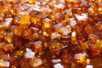 yellow amber stones rectangular closeup lie on a flat surface