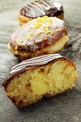 Doughnuts with stuffing on a wooden background