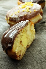 Doughnuts with stuffing on a wooden background