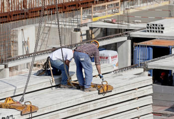 Fototapeta premium Workers in construction site