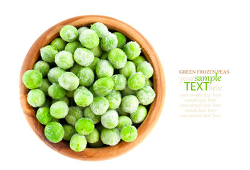 frozen peas in wooden bowl, isolated on white background