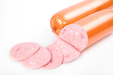 Cooked sausage, ham with slices isolated on white background