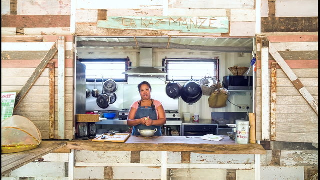 Woman cooking in outdoor kitchen