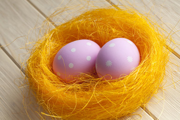Two pink Easter eggs in the nest