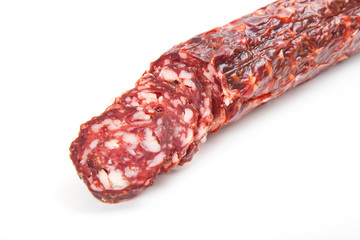 Slices italian salami sausage on white background