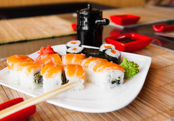 Roll with Cream Cheese and Cucumber inside. Salmon topped